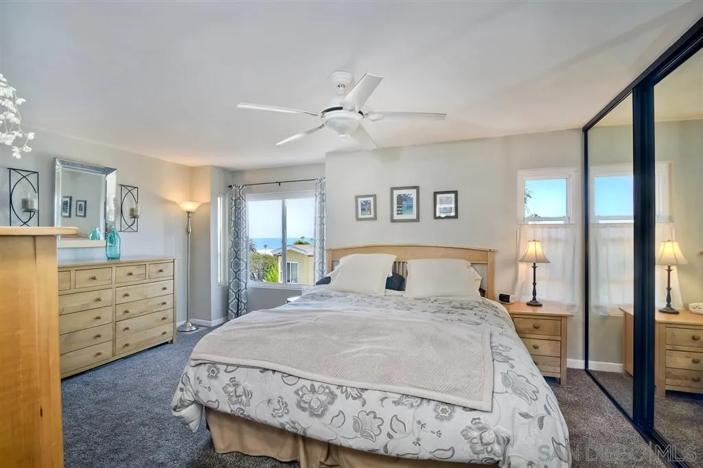 2130 Orinda Drive, Unit E Cardiff, CA 92007 - Photo 11 of 24 a bedroom with a bed and a dresser