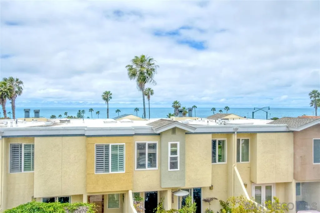 2130 Orinda Drive, Unit E Cardiff, CA 92007 - Photo 17 of 24 a view of a white building among the city and mountain
