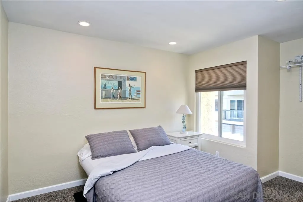 2130 Orinda Drive, Unit E Cardiff, CA 92007 - Photo 18 of 24 a bed room with a bed and a window