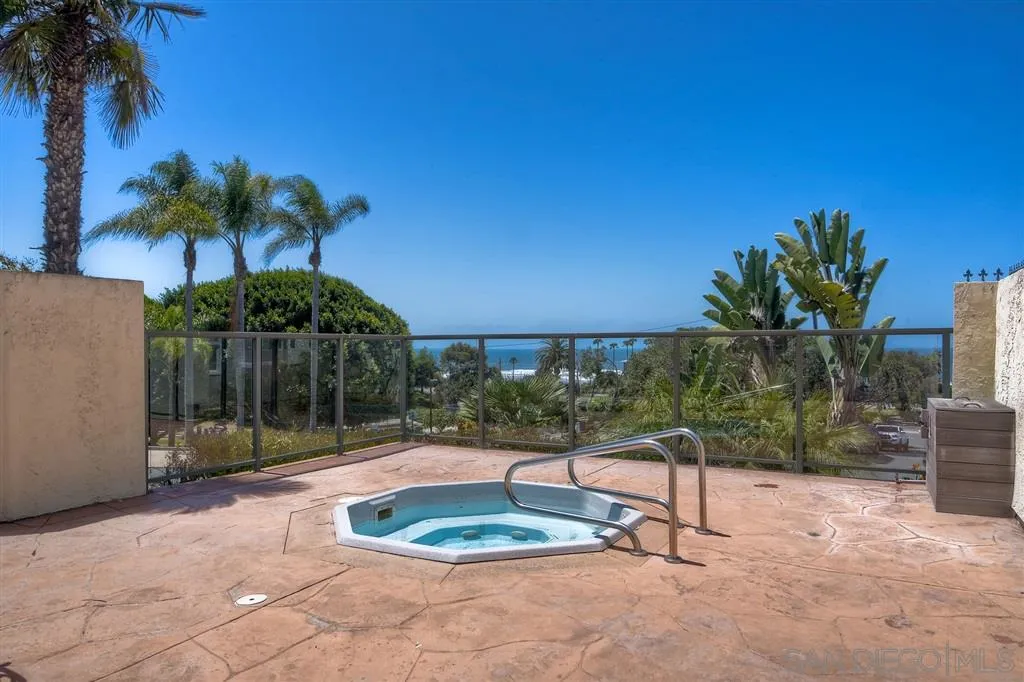 2130 Orinda Drive, Unit E Cardiff, CA 92007 - Photo 21 of 24 a backyard of a house with fountain table and chairs