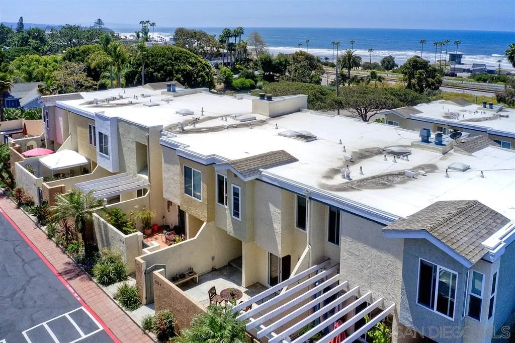 2130 Orinda Drive, Unit E Cardiff, CA 92007 - Photo 23 of 24 an aerial view of a house with swimming pool and a yard