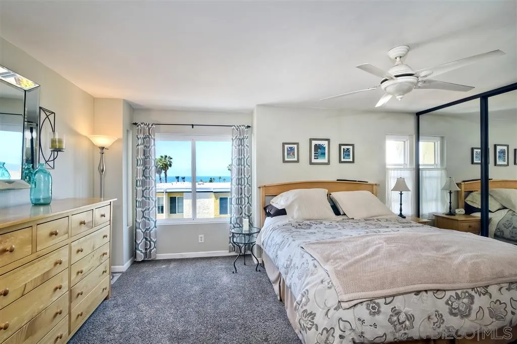 2130 Orinda Drive, Unit E Cardiff, CA 92007 - Photo 10 of 24 a bedroom with a large bed and a window