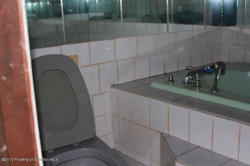 71 Bowens Road Moscow, PA 18444 - Photo 23 of 29 a bathroom with a sink and mirror