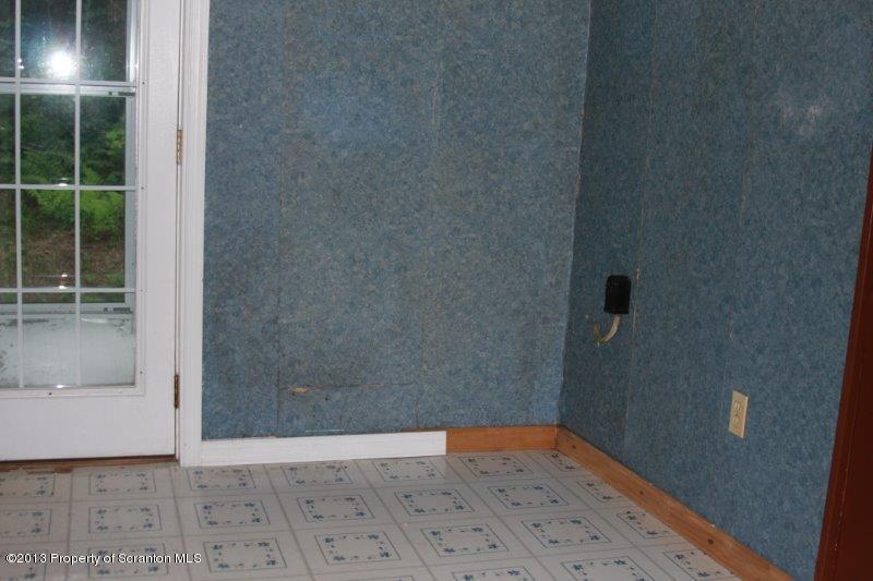 71 Bowens Road Moscow, PA 18444 - Photo 7 of 29 a view of an empty room with window and wooden floor