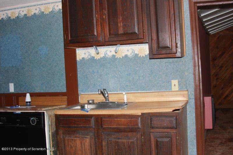 71 Bowens Road Moscow, PA 18444 - Photo 8 of 29 a sink with granite countertop a sink and cabinets