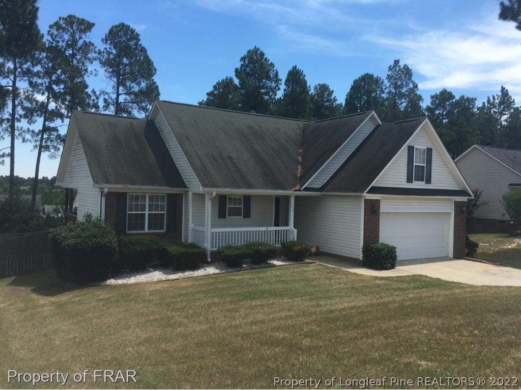 154 Chesapeake Road Cameron, NC 28326 - Photo 1 of 29 a view of a house with a yard