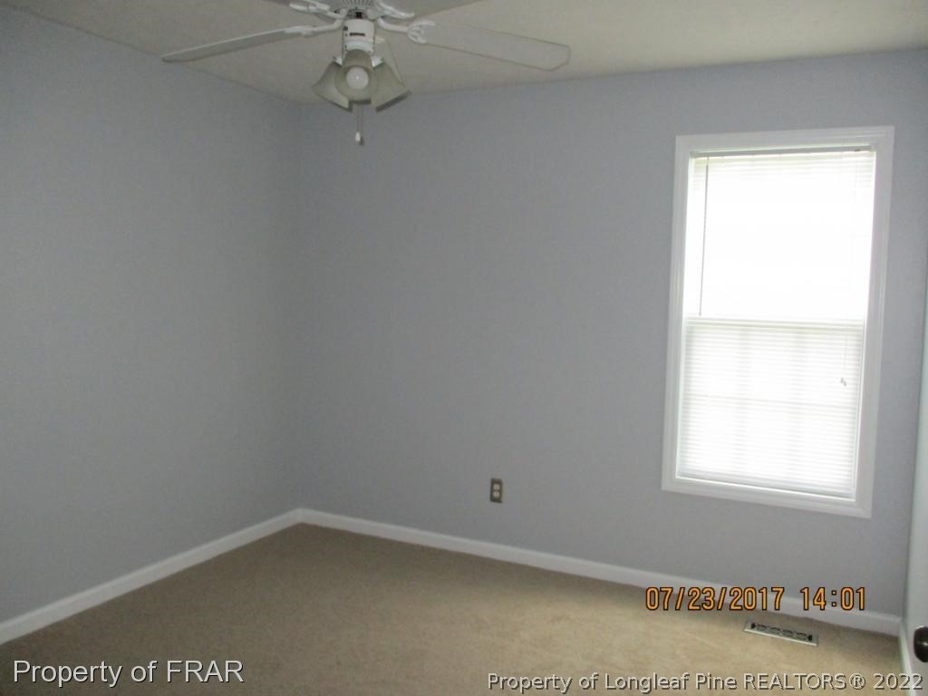 154 Chesapeake Road Cameron, NC 28326 - Photo 14 of 29 an empty room with a window