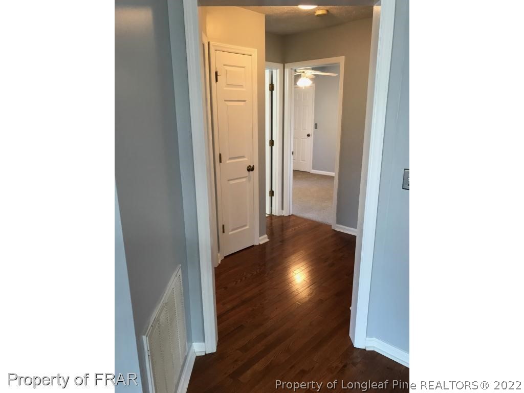 154 Chesapeake Road Cameron, NC 28326 - Photo 15 of 29 a view of a hallway with wooden floor