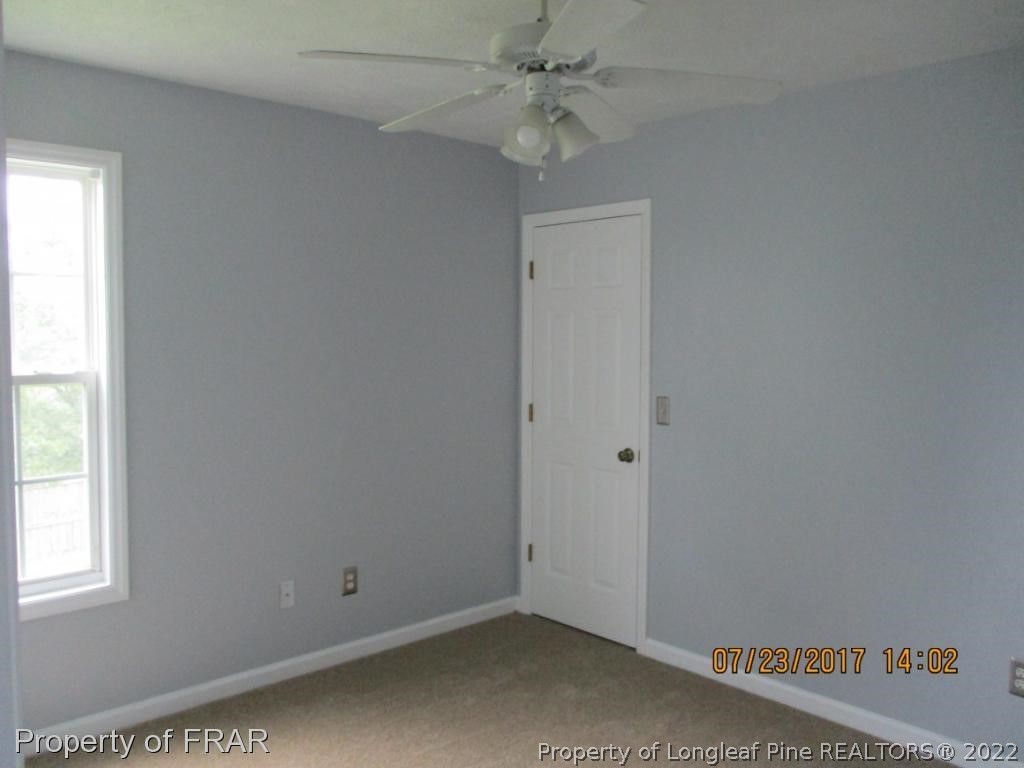 154 Chesapeake Road Cameron, NC 28326 - Photo 16 of 29 an empty room with windows and fan