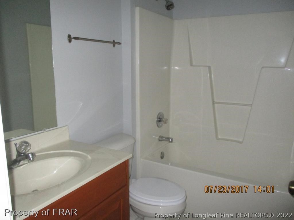 154 Chesapeake Road Cameron, NC 28326 - Photo 17 of 29 a bathroom with a sink a toilet and bathtub