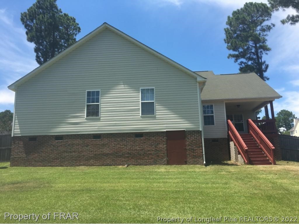 154 Chesapeake Road Cameron, NC 28326 - Photo 27 of 29 a front view of a house with a yard