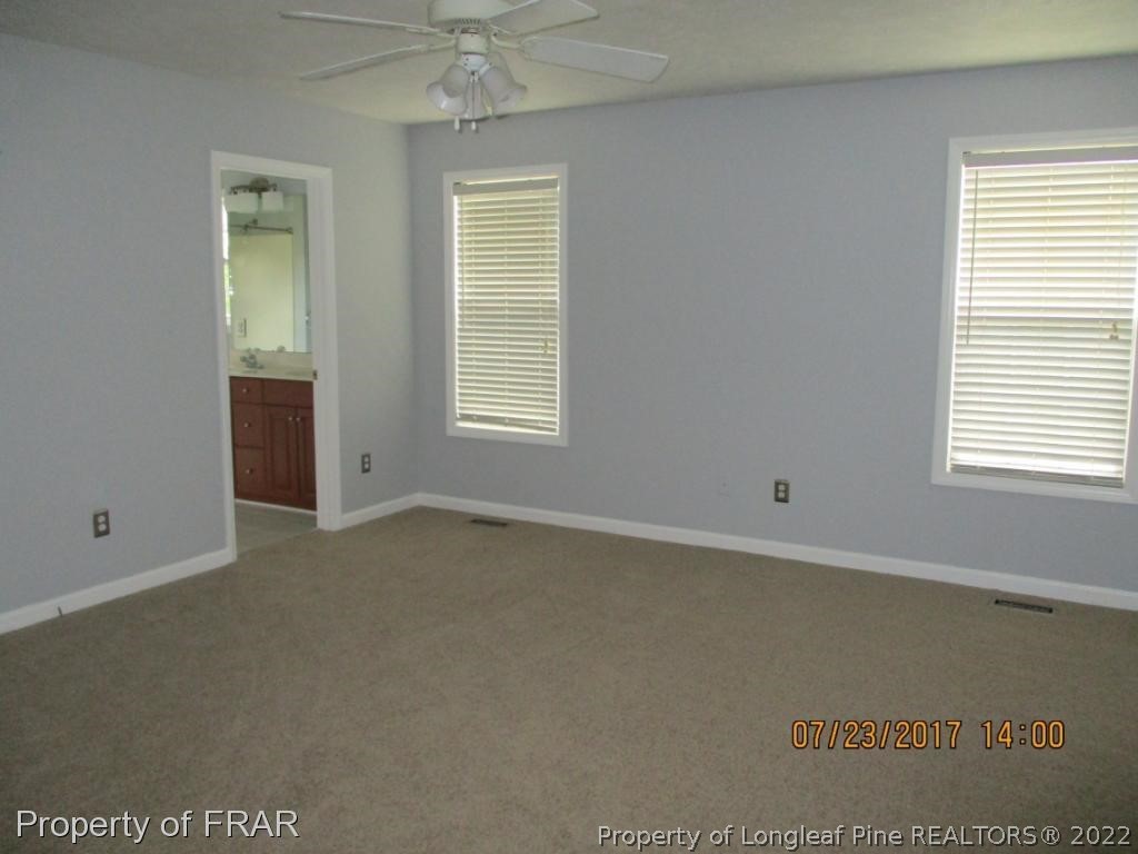 154 Chesapeake Road Cameron, NC 28326 - Photo 10 of 29 an empty room with a window