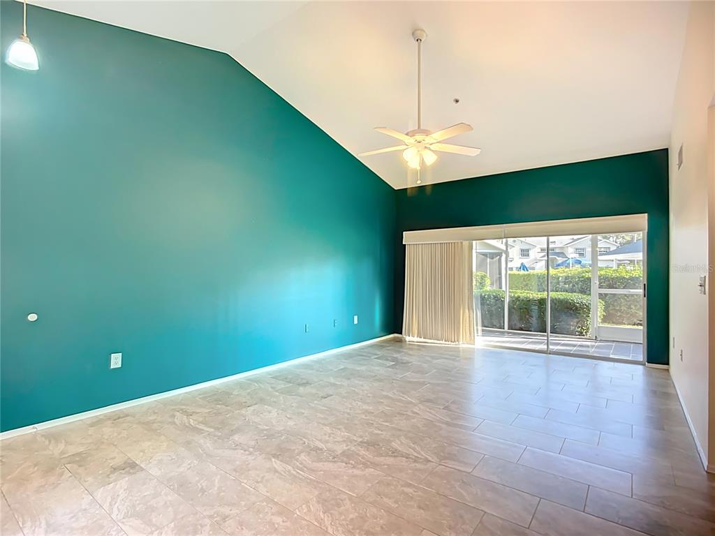 6330 Green Oak Circle, Unit 6330 Bradenton, FL 34203 - Photo 26 of 58 a view of a big room with windows and fireplace