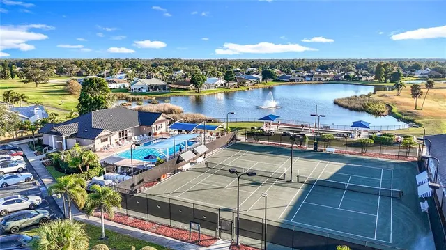a view of a porch with furniture and garden