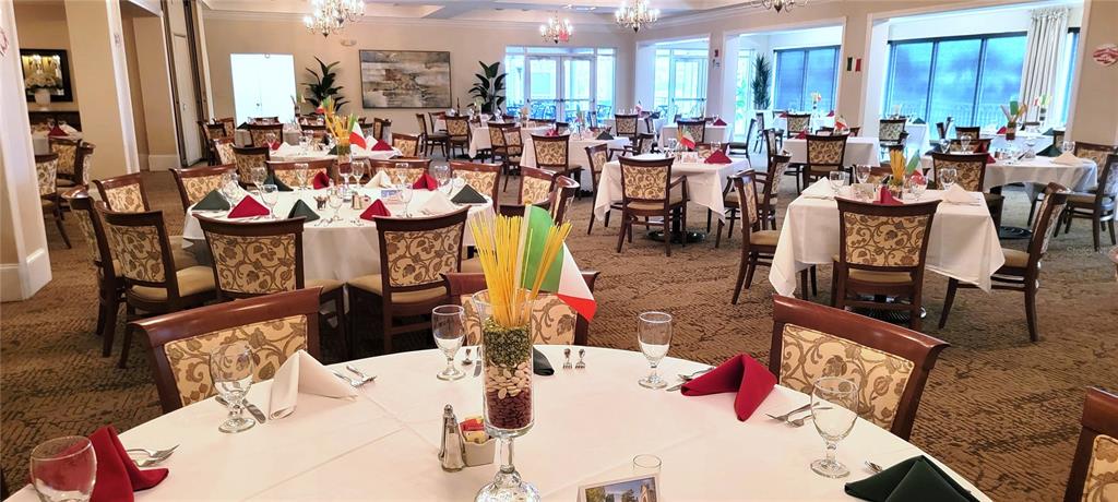 6330 Green Oak Circle, Unit 6330 Bradenton, FL 34203 - Photo 50 of 58 a view of a dining hall with many windows