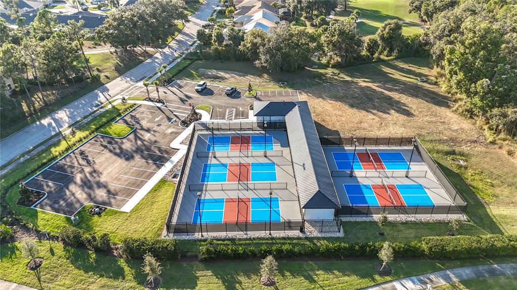 6330 Green Oak Circle, Unit 6330 Bradenton, FL 34203 - Photo 57 of 58 an aerial view of multiple houses with yard