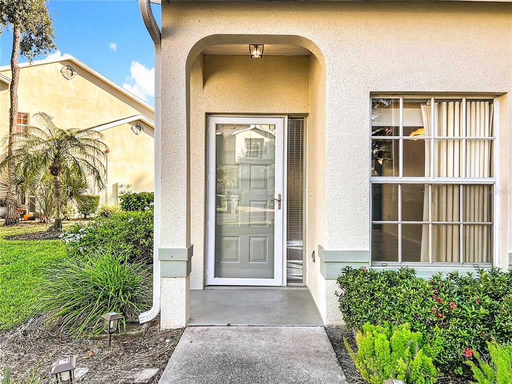 6330 Green Oak Circle, Unit 6330 Bradenton, FL 34203 - Photo 8 of 58 a front view of a house with a garden