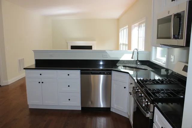 a kitchen with a stove and a microwave