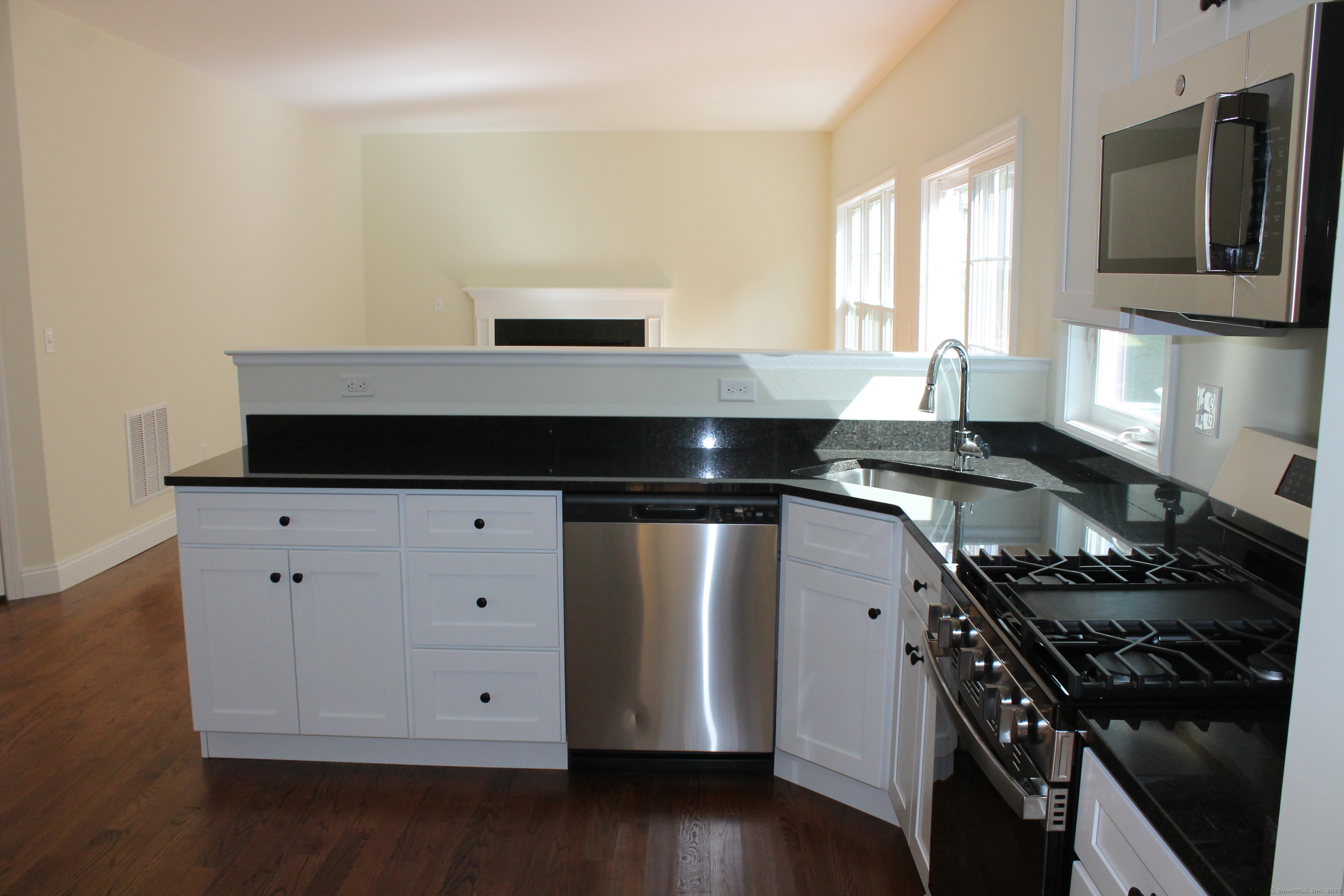 15 Glen Ridge Road Hamden, CT 06518 - Photo 14 of 36 a kitchen with a stove and a microwave