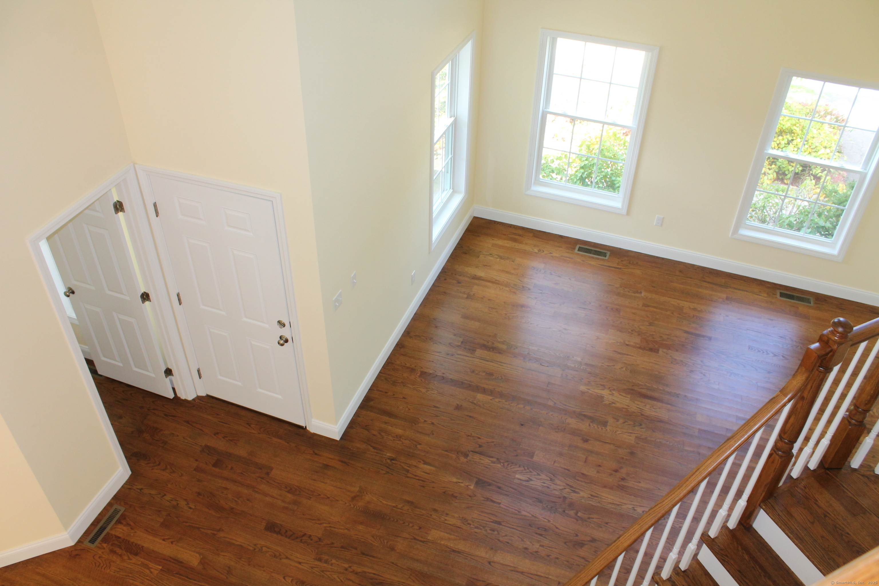 15 Glen Ridge Road Hamden, CT 06518 - Photo 20 of 36 a view of an empty room with wooden floor and a window