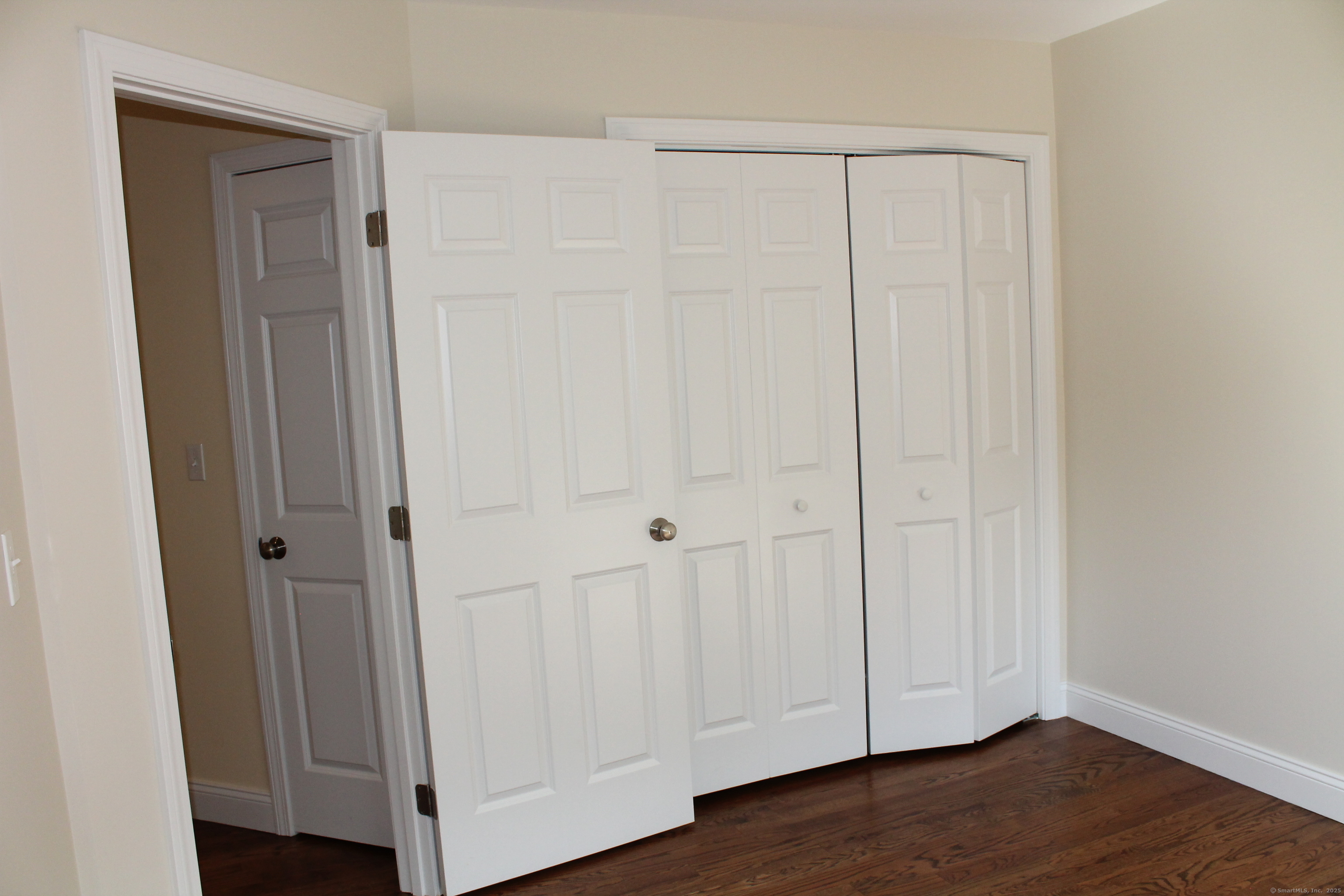 15 Glen Ridge Road Hamden, CT 06518 - Photo 29 of 36 a view of a hallway with wooden floor