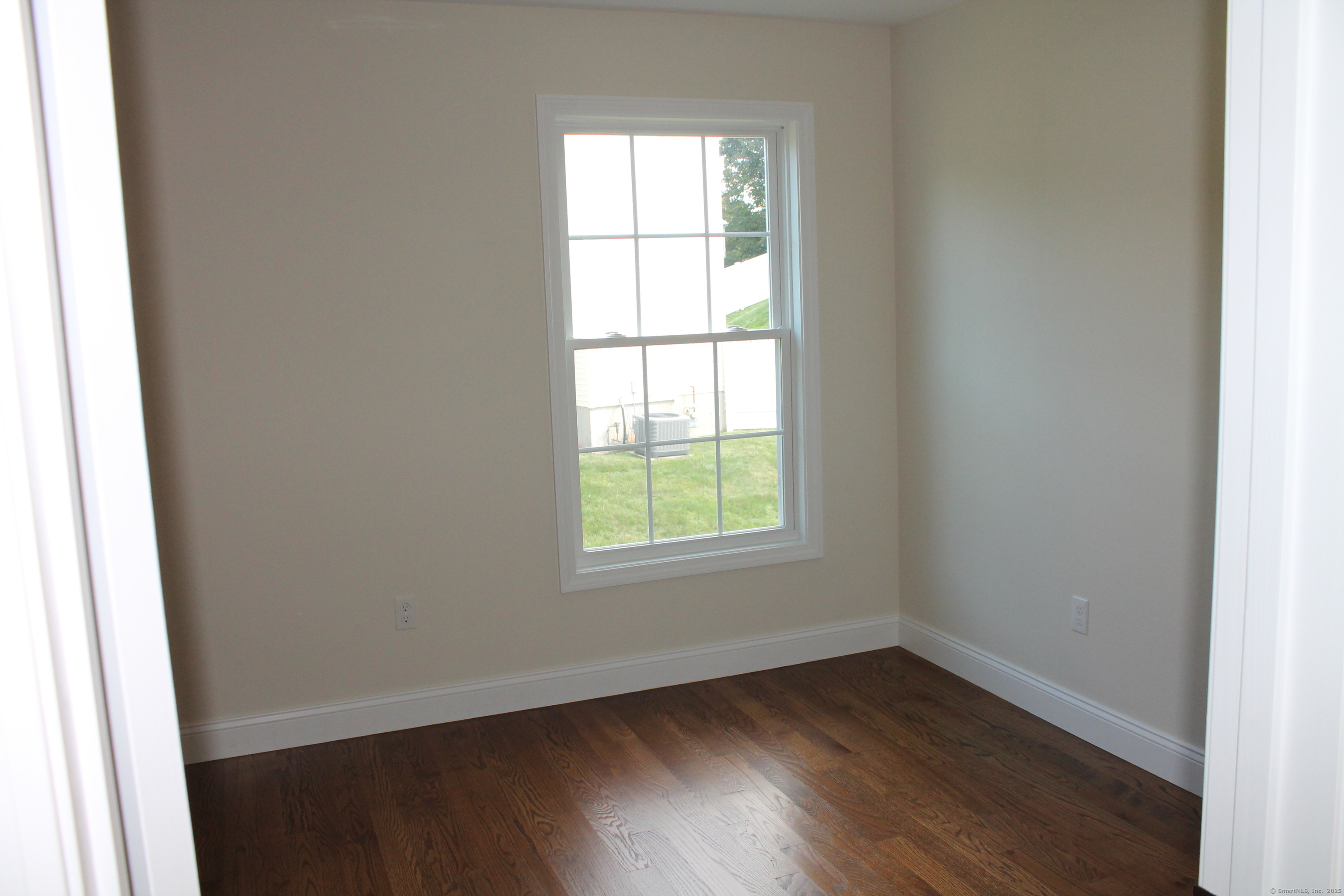15 Glen Ridge Road Hamden, CT 06518 - Photo 31 of 36 an empty room with wooden floor and windows