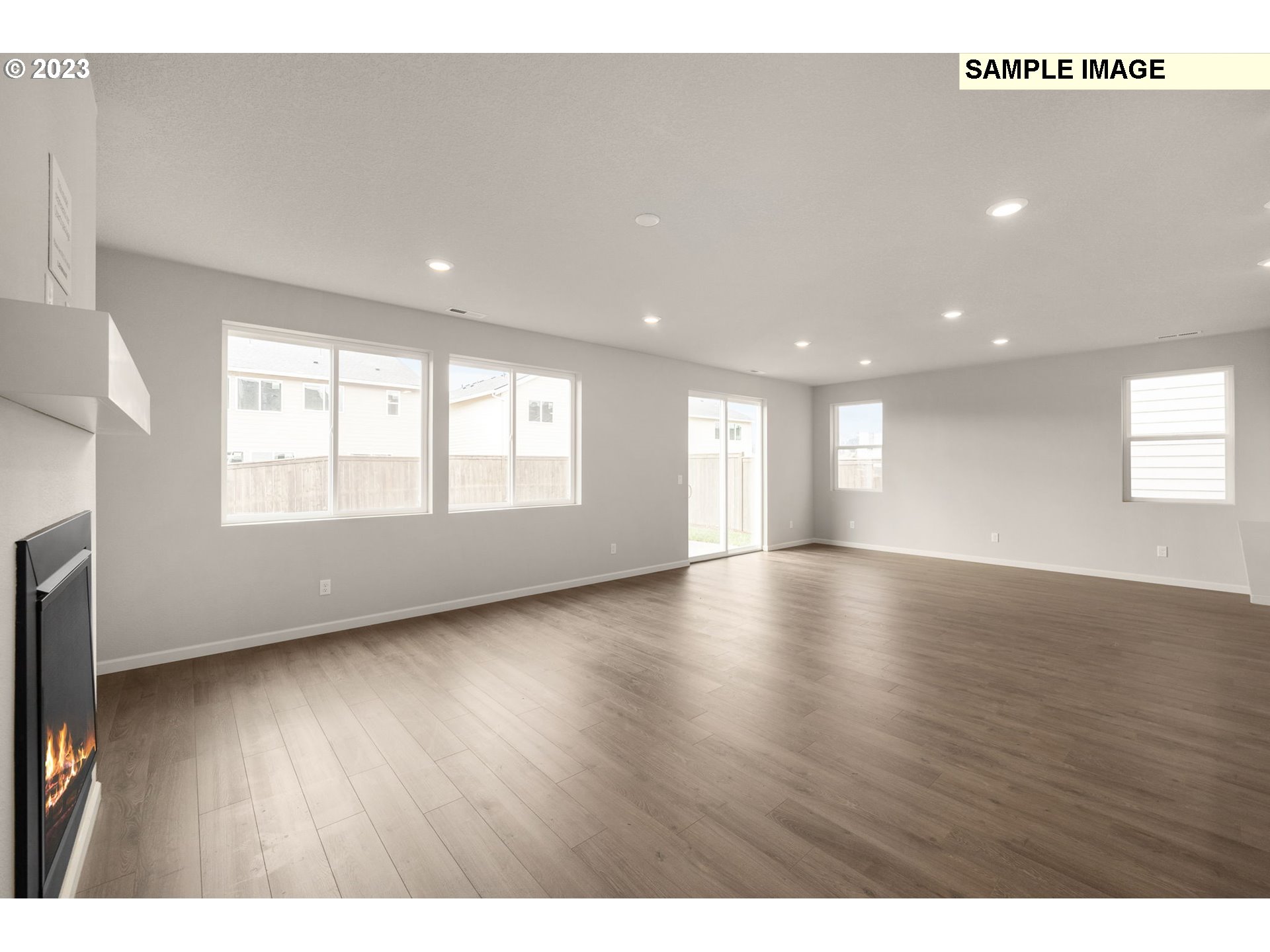 1047 Clemson Street Gervais, OR 97026 - Photo 12 of 38 a view of an empty room with wooden floor and a window