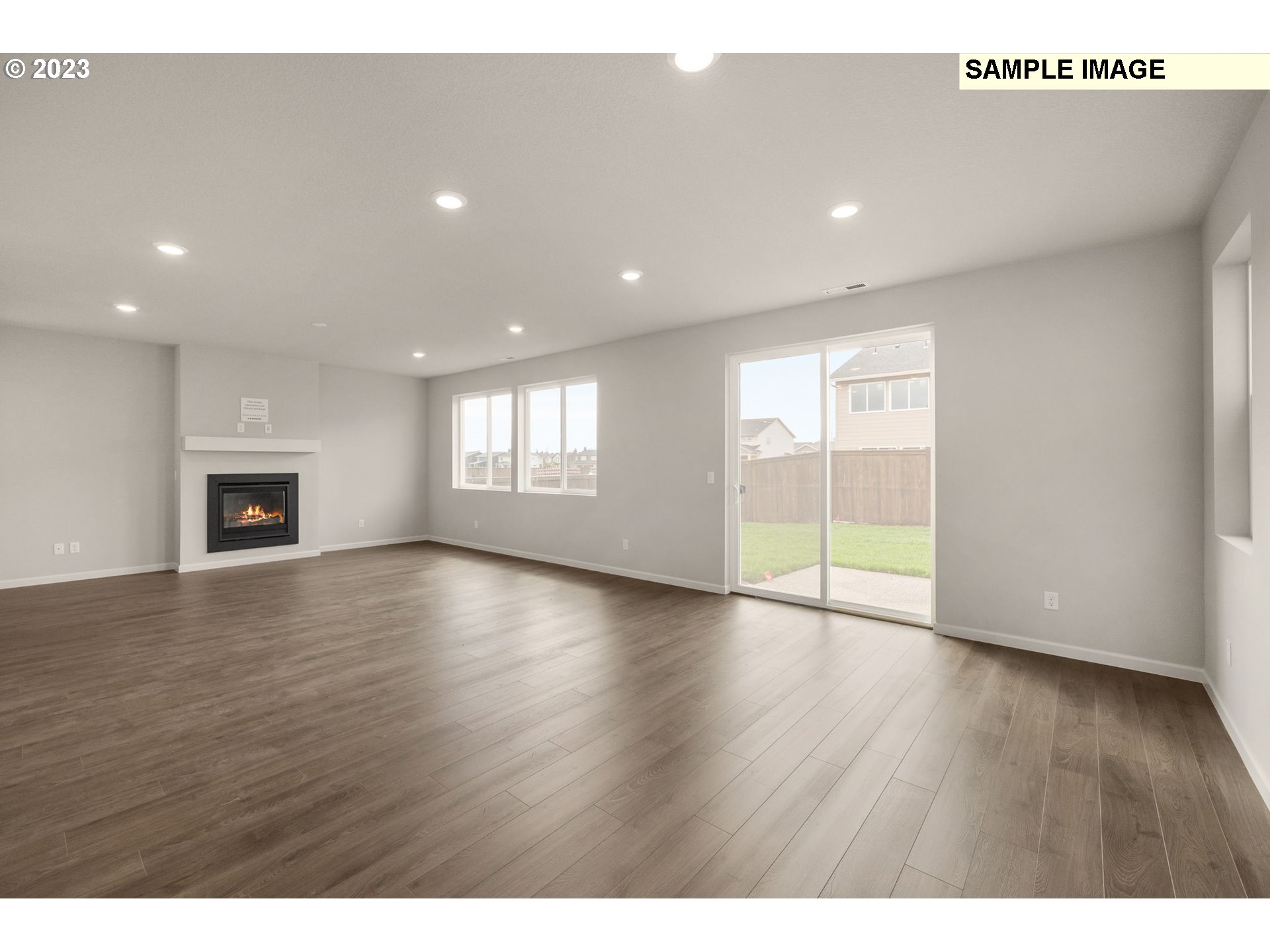 1047 Clemson Street Gervais, OR 97026 - Photo 15 of 38 a view of an empty room with wooden floor and a window