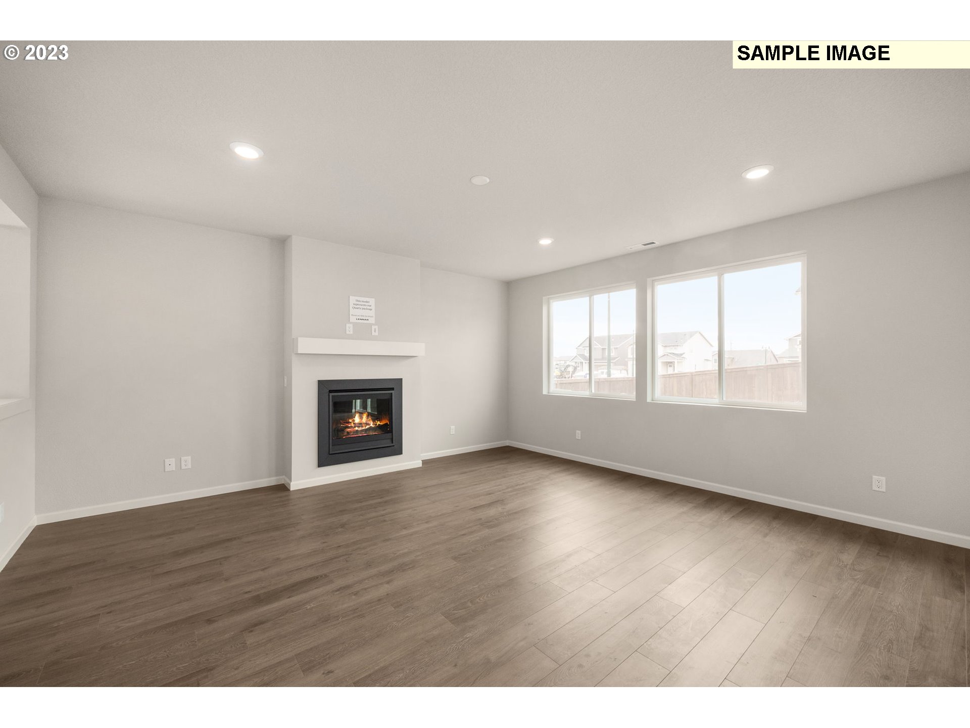 1047 Clemson Street Gervais, OR 97026 - Photo 16 of 38 a view of an empty room with wooden floor and a window