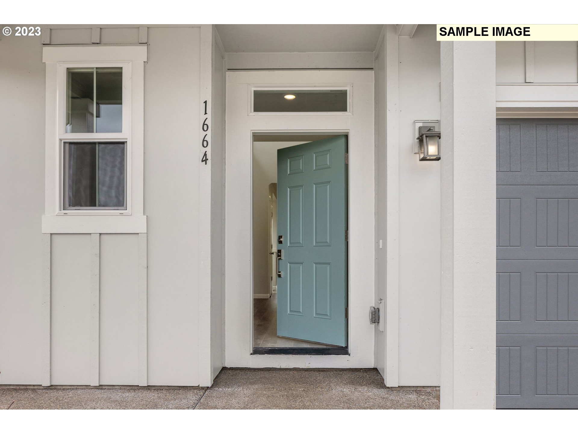 1047 Clemson Street Gervais, OR 97026 - Photo 2 of 38 a view of a hallway with wooden door
