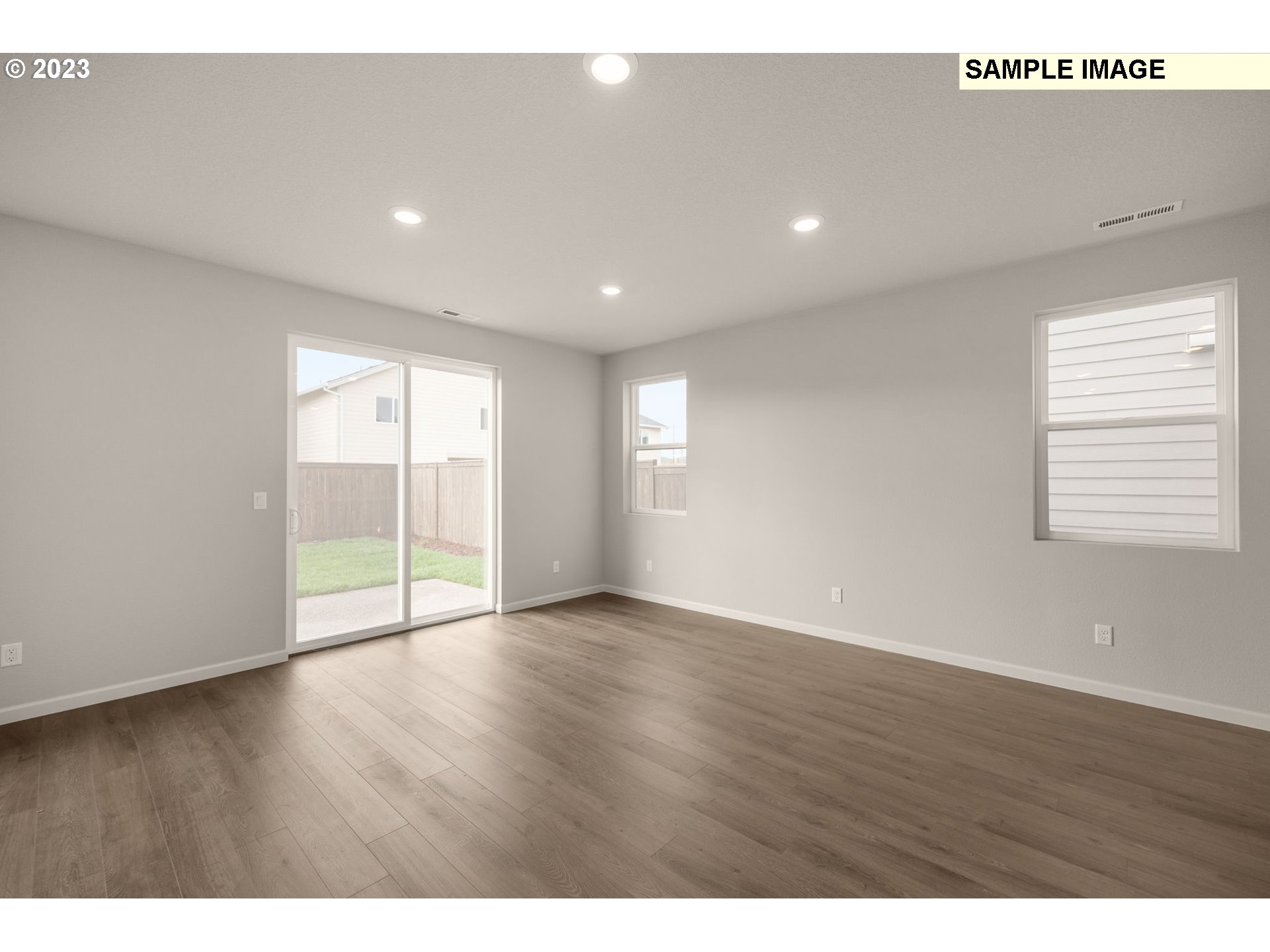 1047 Clemson Street Gervais, OR 97026 - Photo 22 of 38 a view of an empty room with wooden floor and a window
