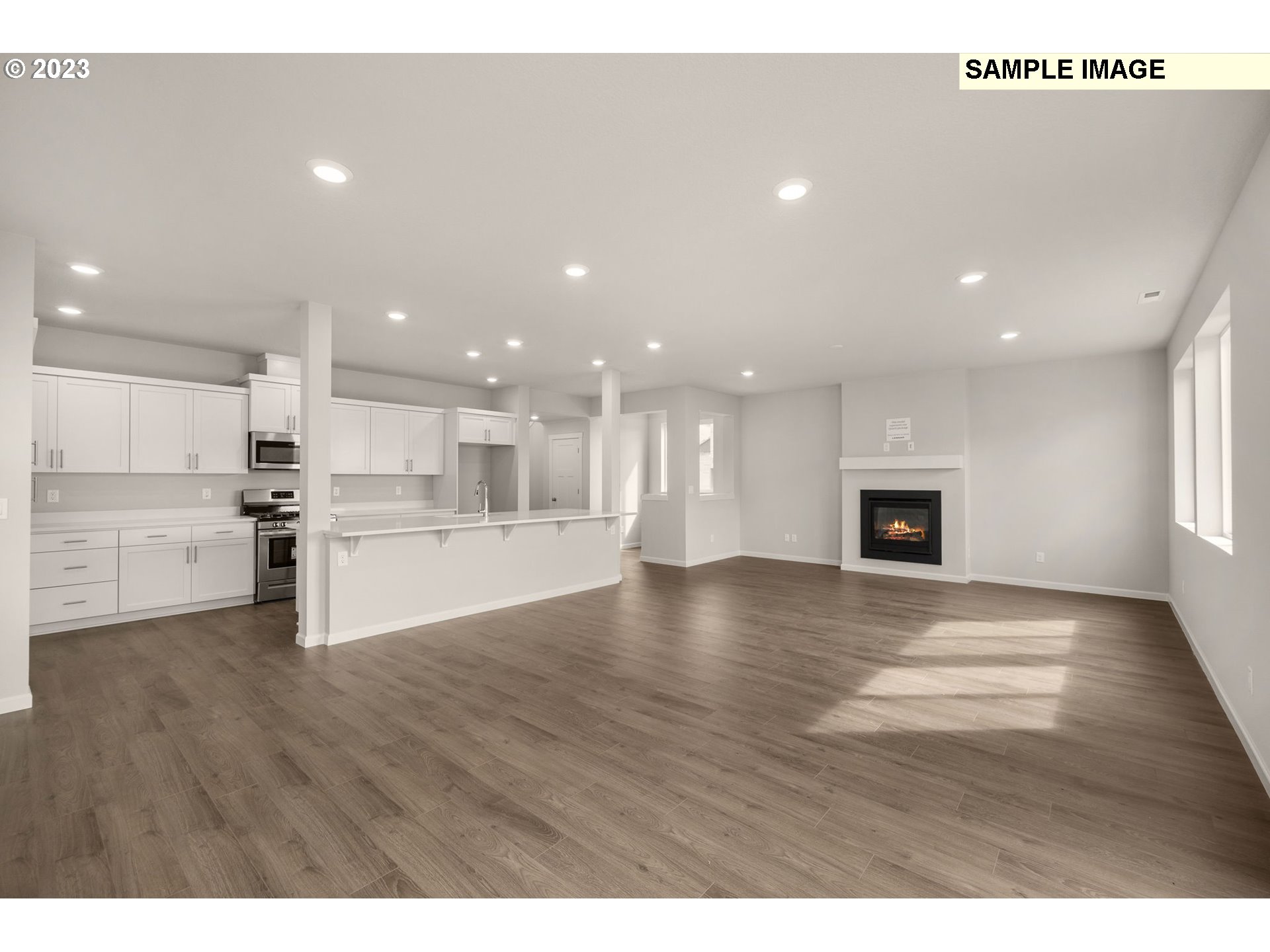 1047 Clemson Street Gervais, OR 97026 - Photo 23 of 38 a view of kitchen with kitchen island a sink wooden floor and a stove