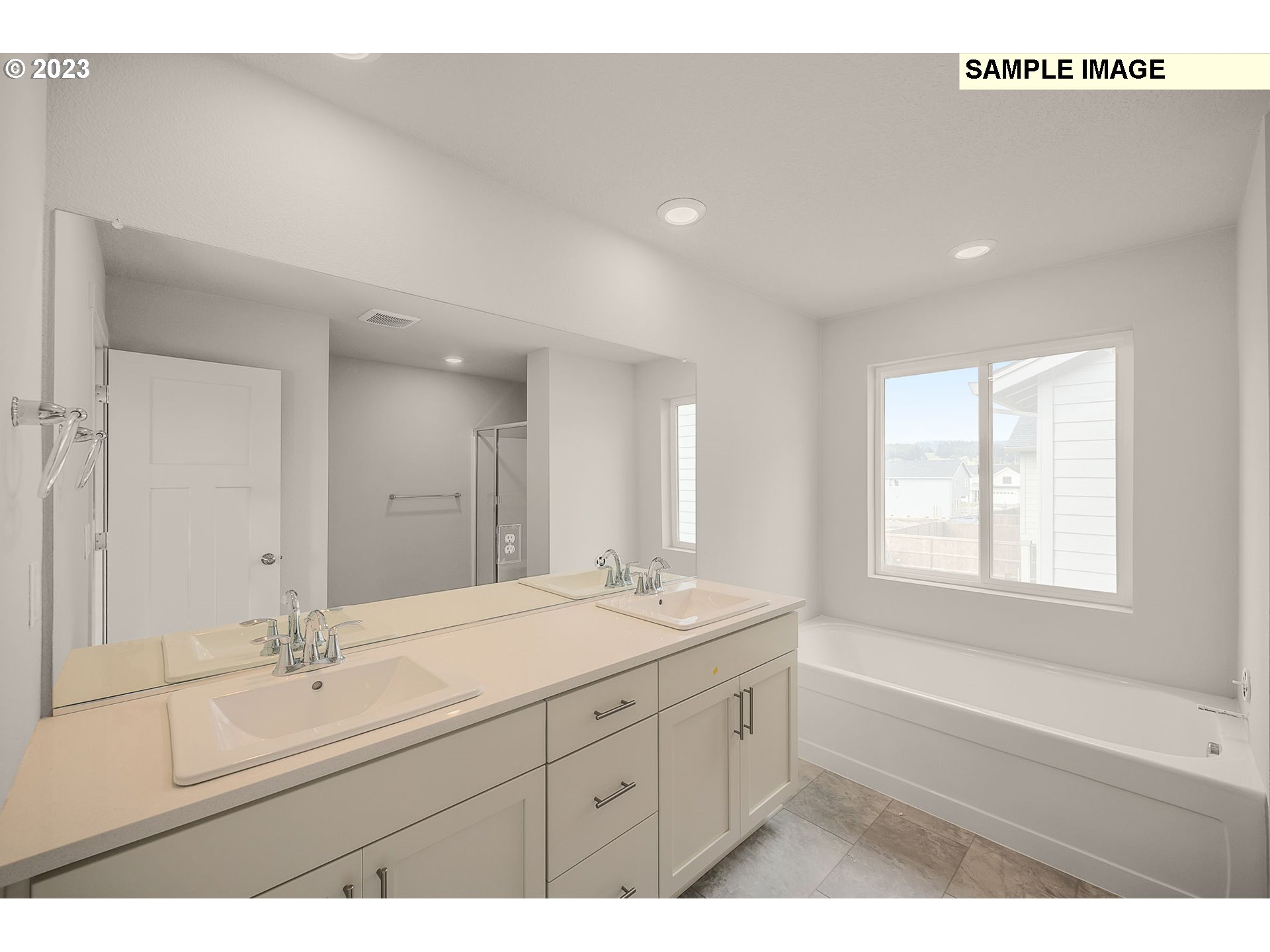 1047 Clemson Street Gervais, OR 97026 - Photo 32 of 38 a bathroom with a sink mirror and a bathtub