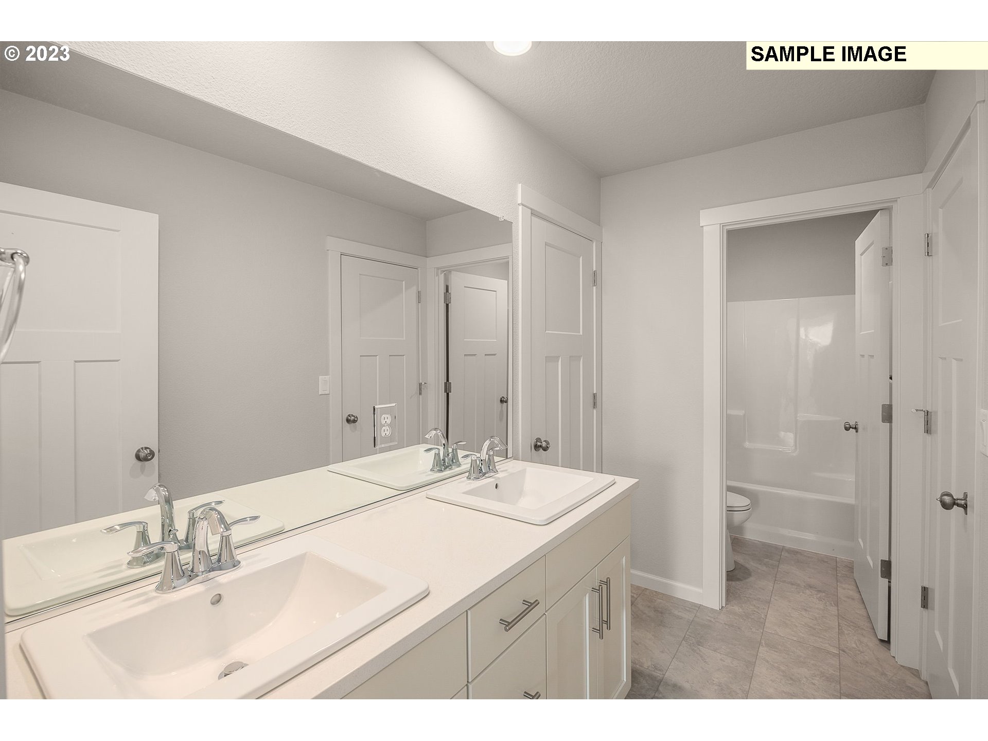 1047 Clemson Street Gervais, OR 97026 - Photo 34 of 38 a bathroom with a sink a mirror and a shower