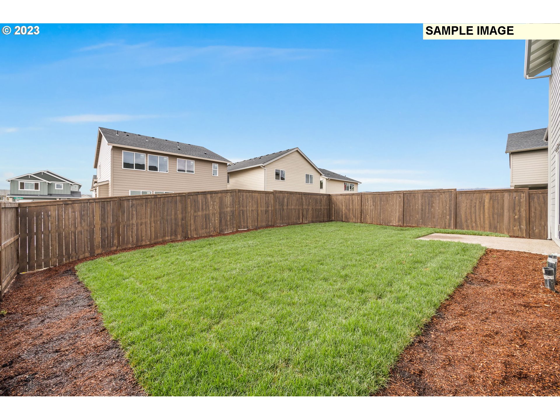 1047 Clemson Street Gervais, OR 97026 - Photo 37 of 38 a view of a house with a yard and wooden fence