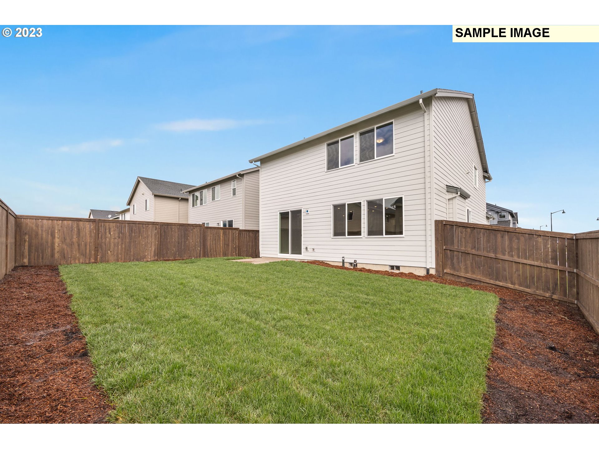 1047 Clemson Street Gervais, OR 97026 - Photo 38 of 38 a backyard of a house with wooden floor and fence
