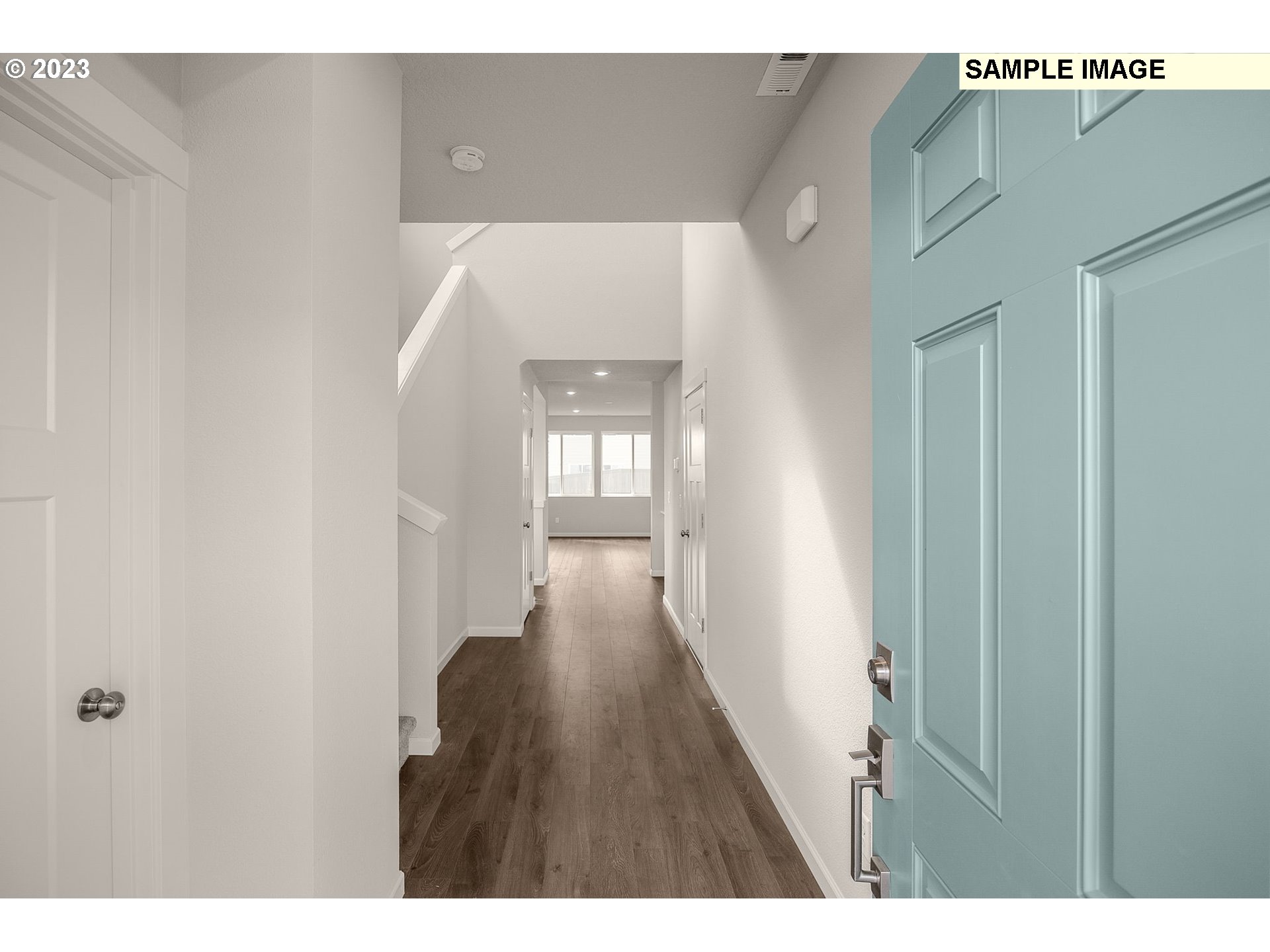 1047 Clemson Street Gervais, OR 97026 - Photo 4 of 38 a view of a hallway with wooden floor and staircase