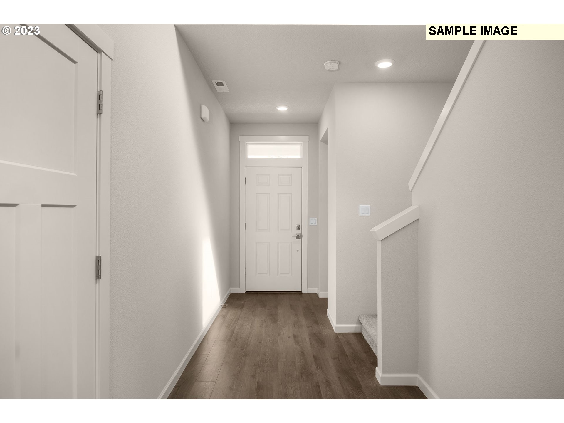 1047 Clemson Street Gervais, OR 97026 - Photo 5 of 38 a view of hallway with wooden floor