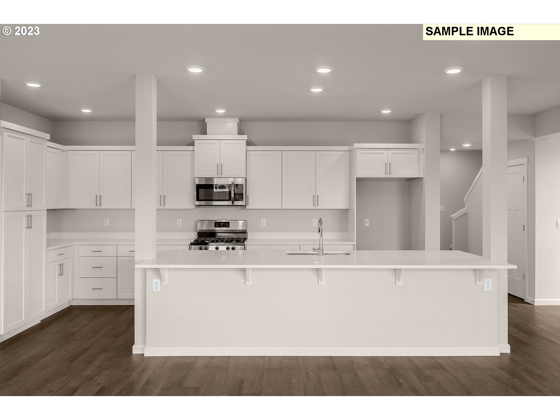 1047 Clemson Street Gervais, OR 97026 - Photo 8 of 38 a kitchen with stainless steel appliances granite countertop a sink a stove and a refrigerator
