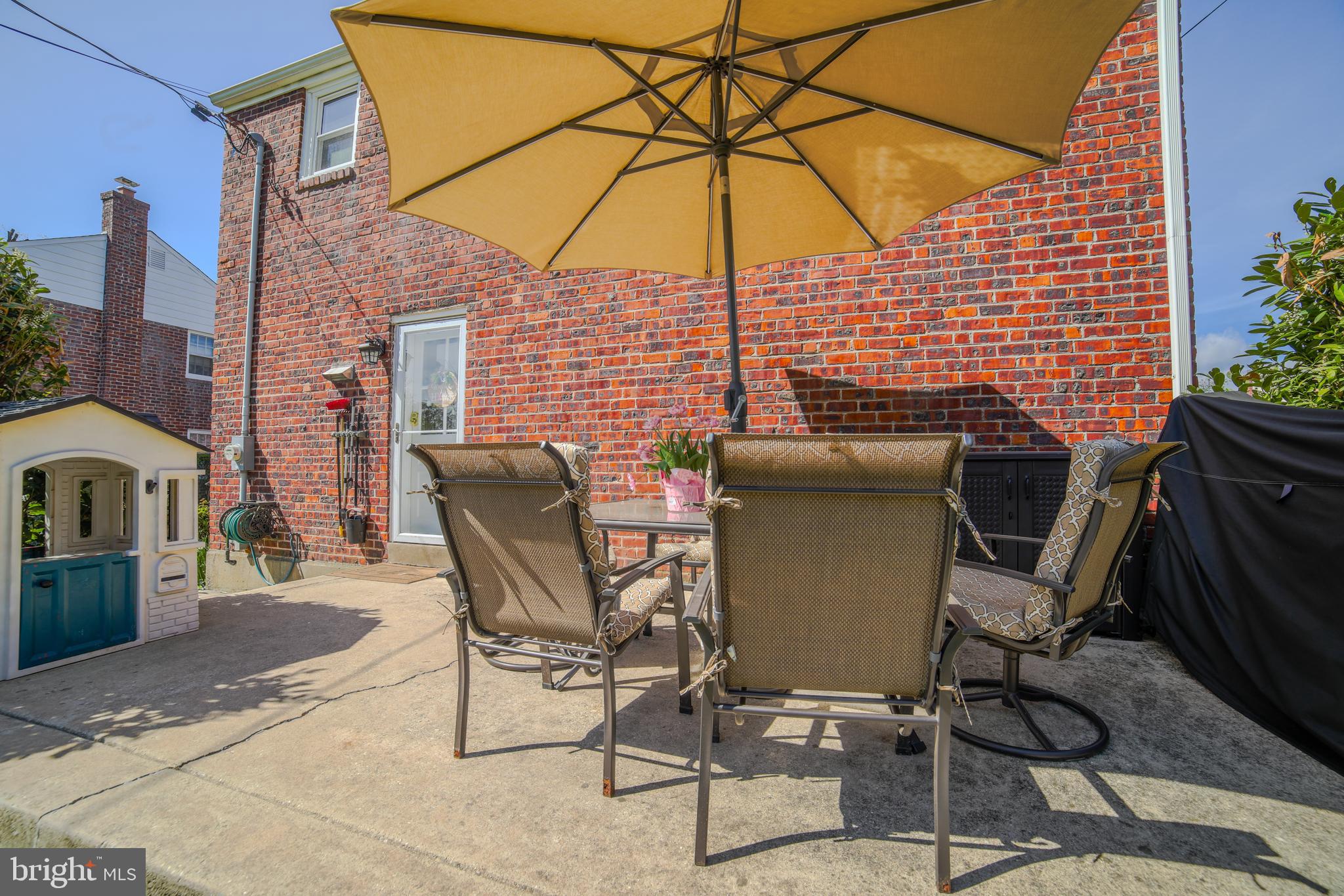 2625 Wendy Road Havertown, PA 19083 - Photo 35 of 39 a view of a patio with a table and chairs under an umbrella