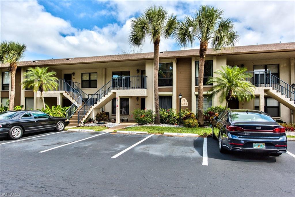 1224 Commonwealth Circle, Unit N204 Naples, FL 34116 - Photo 24 of 33 a front view of a house with garden