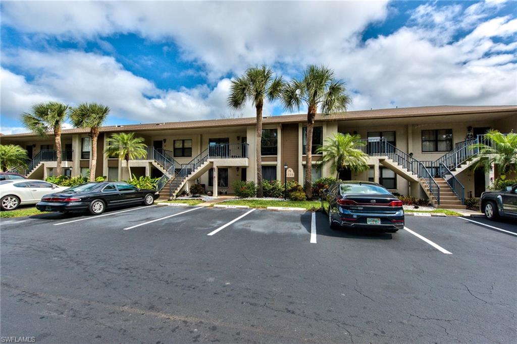 1224 Commonwealth Circle, Unit N204 Naples, FL 34116 - Photo 25 of 33 a car parked in front of house