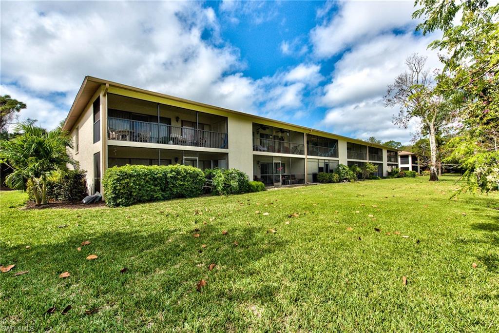 1224 Commonwealth Circle, Unit N204 Naples, FL 34116 - Photo 28 of 33 a view of house with yard