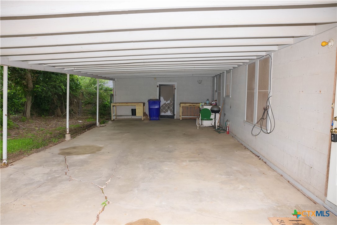 204 Orth Street Yoakum, TX 77995 - Photo 15 of 16 a view of a room with furniture and floor to ceiling window