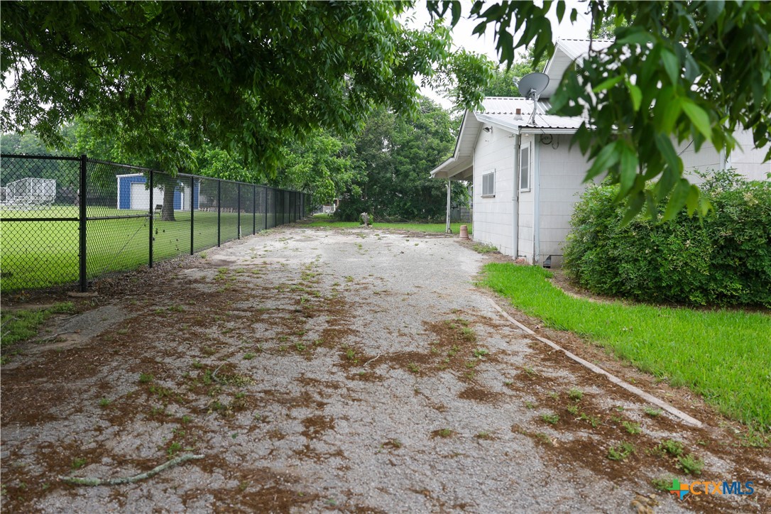 204 Orth Street Yoakum, TX 77995 - Photo 16 of 16 a view of backyard with green space
