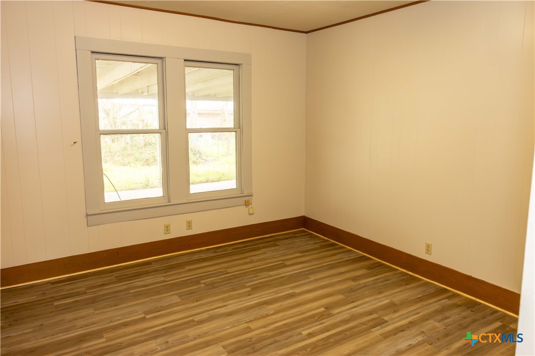 204 Orth Street Yoakum, TX 77995 - Photo 3 of 16 a view of a room with wooden floor and a window