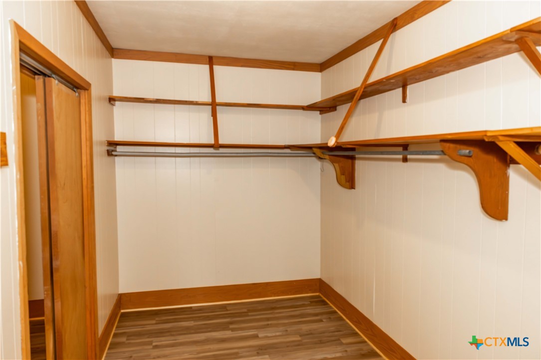 204 Orth Street Yoakum, TX 77995 - Photo 7 of 16 a view of a room with racks on the wall