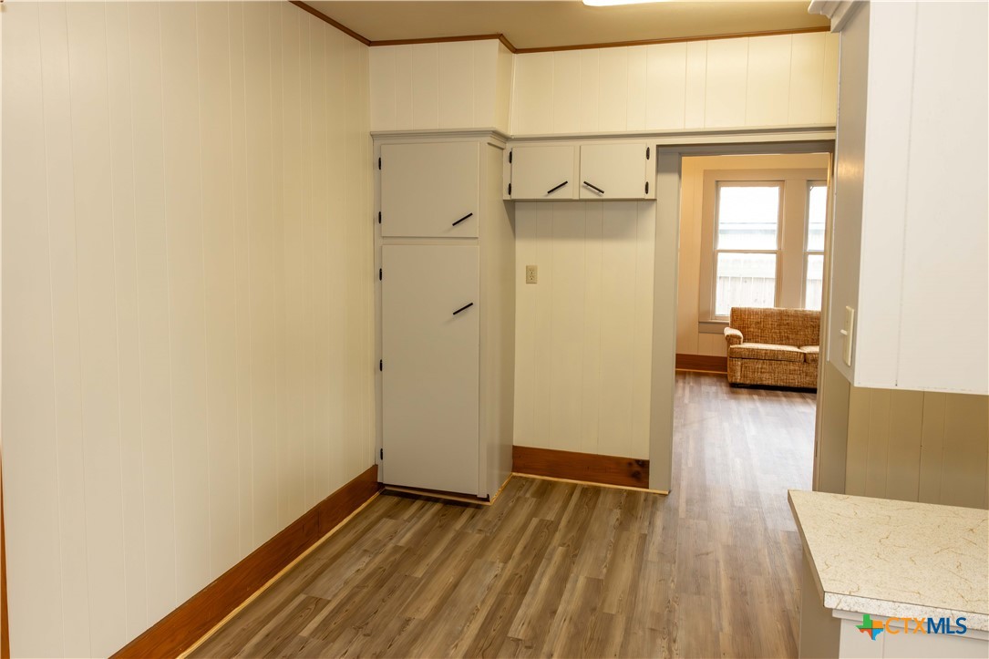 204 Orth Street Yoakum, TX 77995 - Photo 8 of 16 a view of walk in closet with wooden floor