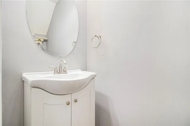 a bathroom with a sink and mirror