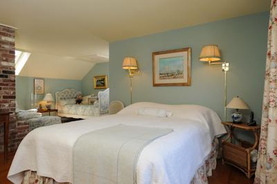65 Captains Walk North Chatham, MA 02650 - Photo 11 of 13 a bedroom with a bed and wooden floor